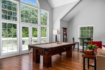 The pool table add fun to the clubhouse.